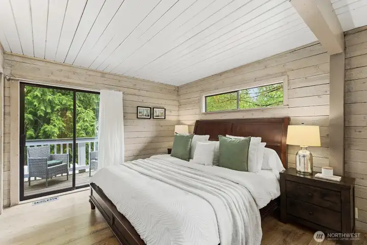 Primary bedroom with three closets and deck