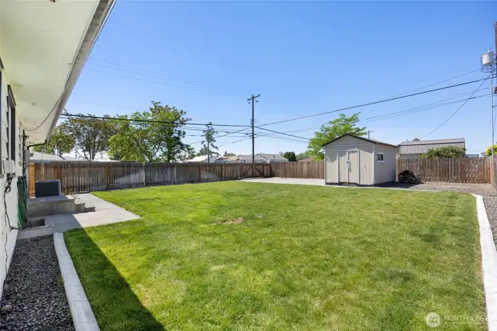 fully fenced large backyard with UGS