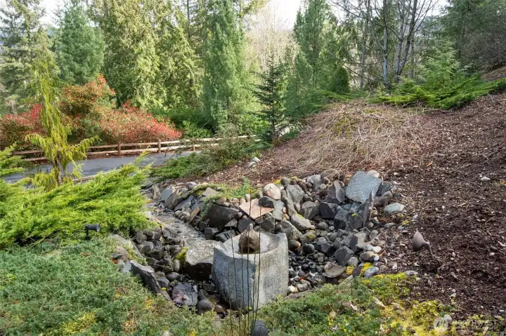 large fountain off deck area to driveway
