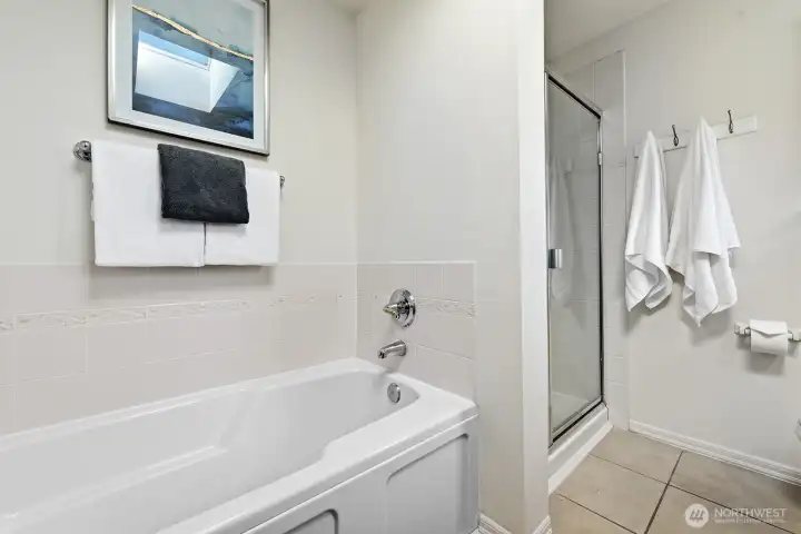 Primary bath with separate soaking tub and shower.