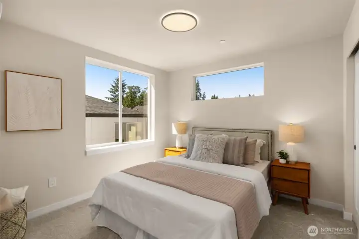 Well-appointed additional bedroom featuring a serene color palette and minimalist aesthetic (these are of model home, similar finishes and layout) Well-appointed additional bedroom featuring a serene color palette and minimalist aesthetic (these are of model home, similar finishes and layout)