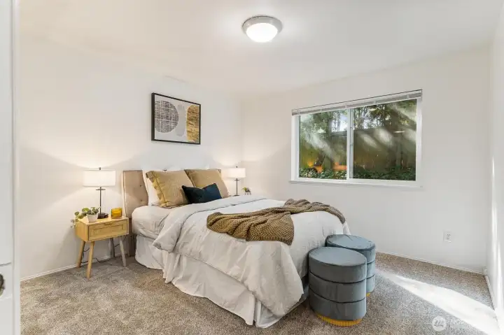 A well-appointed second bedroom provides flexibility—ideal for guests, a home office, or a creative space.