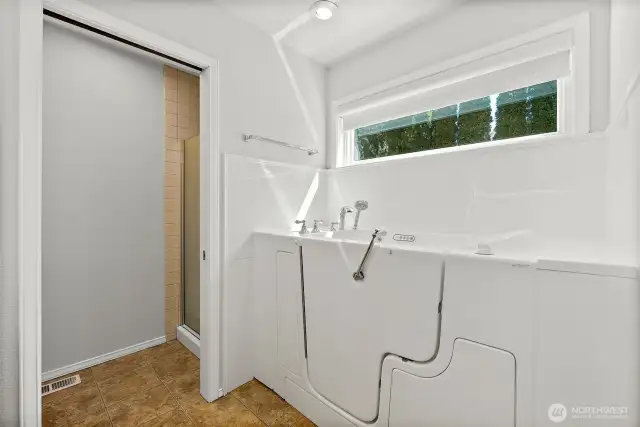 Primary Bathroom with walk-in jacuzzi tub.