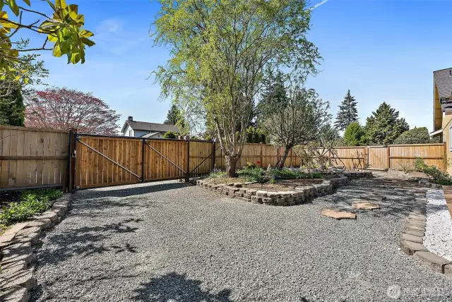 Sliding gate for easy access to the back yard, shed and RV pad.