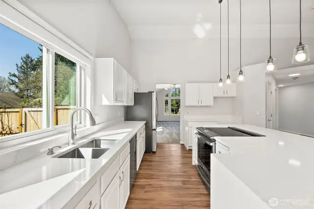 The Kitchen is 12' x 13'. Great working space with all new quartz counters, plenty of storage.
