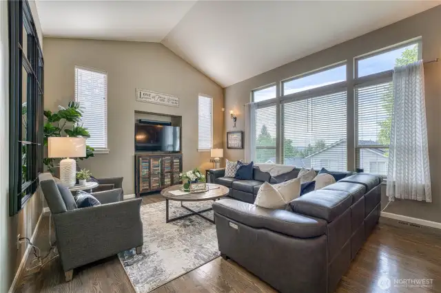 Comfortable living space with vaulted ceilings, transom windows and peekaboo mountain views.