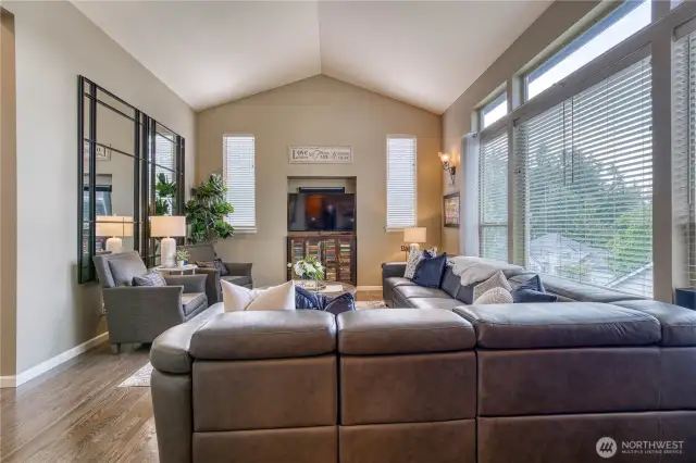 This comfortable space is filled with an abundance of natural light.  The perfect space to gather with family or friends.