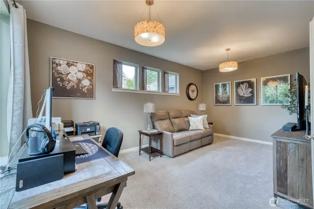 Large bonus room on the main floor offers so many possibilities.