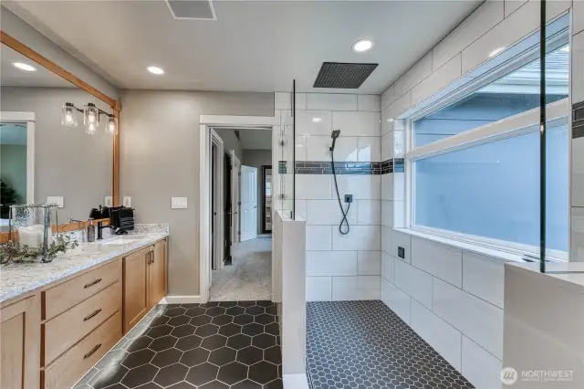 Fully tiled walk in rain shower, makes a day at home feel like the spa.