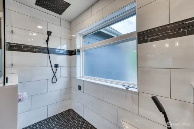 Tiled bench to the right with hand held spray bar for added convenience