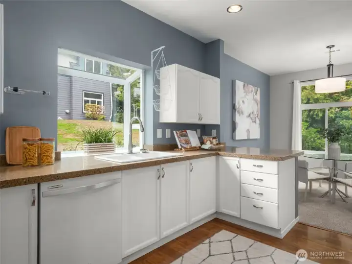 Open kitchen design has connection to dining room