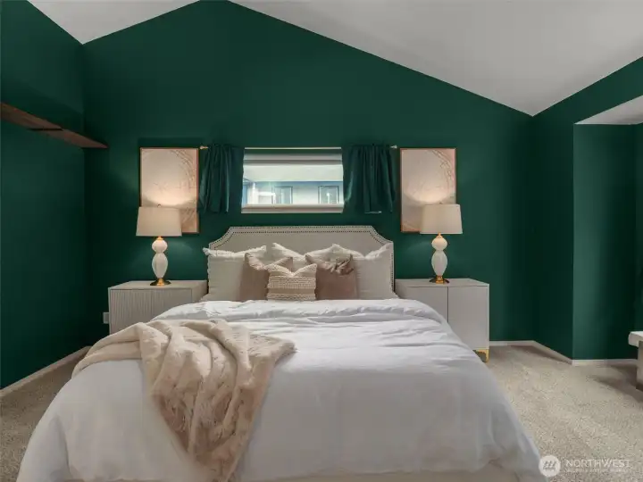 Primary bedroom w vaulted ceiling