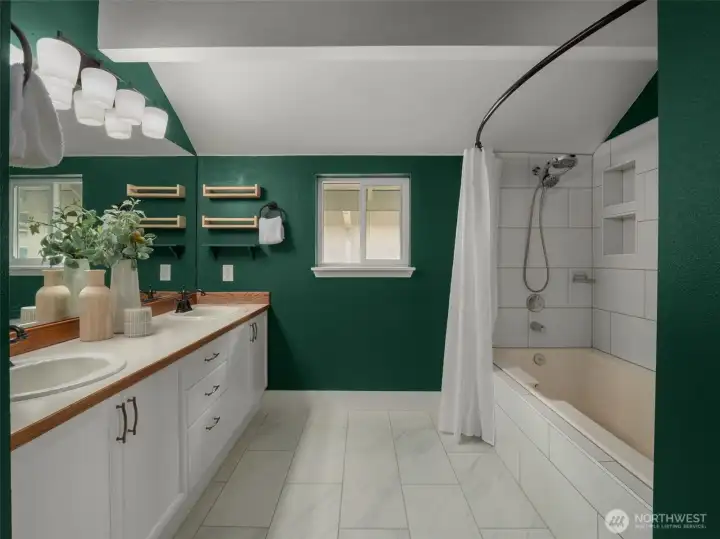 Primary bath recently updated: new tile floor, tile tub surround, new fixtures