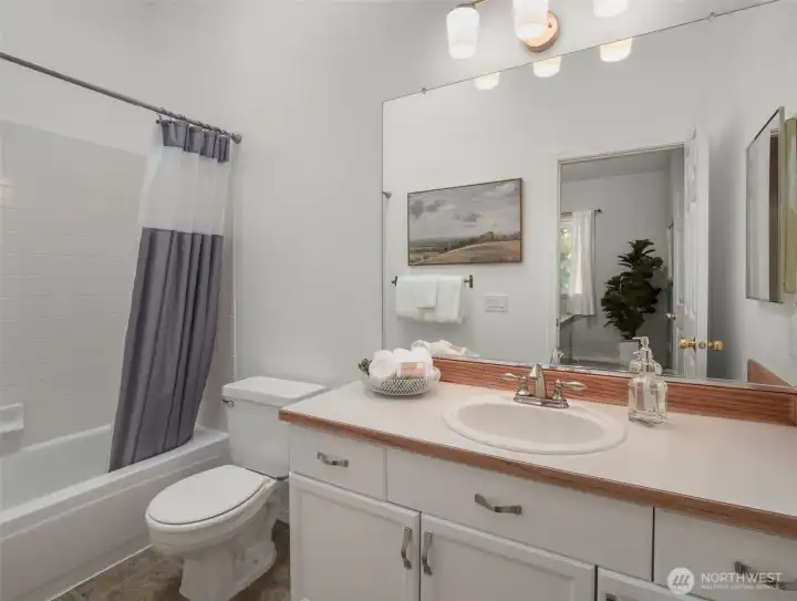 Full bath attached to the second bedroom upstairs