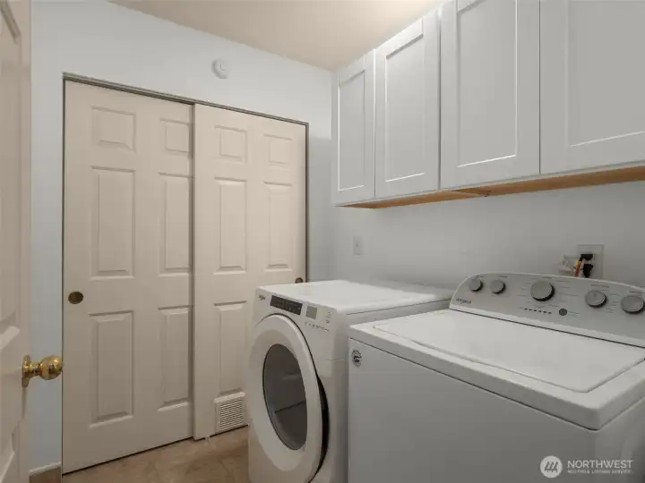 Laundry room with side by side washer and dryer