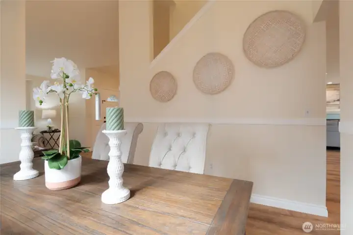 The classic chair rail details add a touch of timeless elegance to the space. Not only do they provide architectural interest, but they also create a polished backdrop for both formal and casual gatherings.