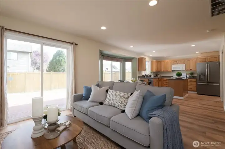 Adjacent to the family room is the slider leading out to the fully-fenced back yard and large, entertainment sized deck.