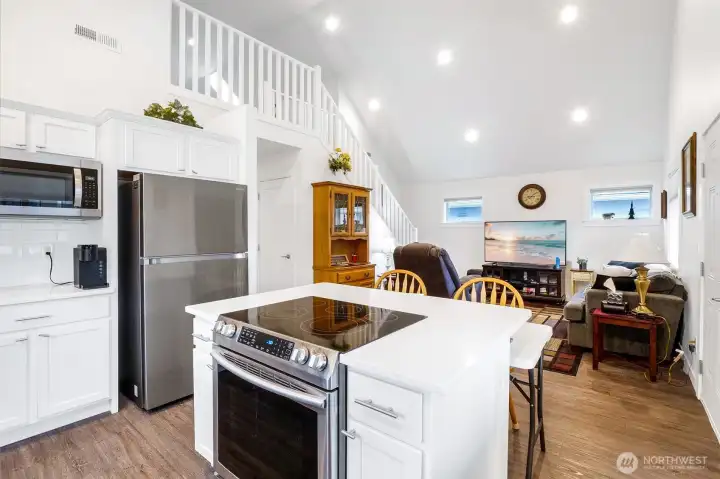 Stainless appliances and quartz countertops.