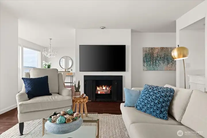 Cozy gas fireplace adds to the ambiance of this light filled great room