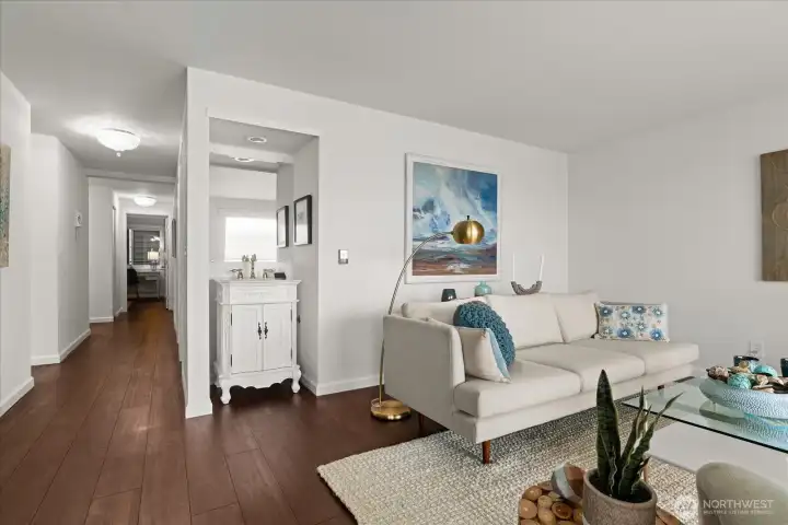 Easy to maintain, while offering the warm rich look of natural wood, luxury vinyl flooring extends throughout the entire condominium, and offers a cohesive feel