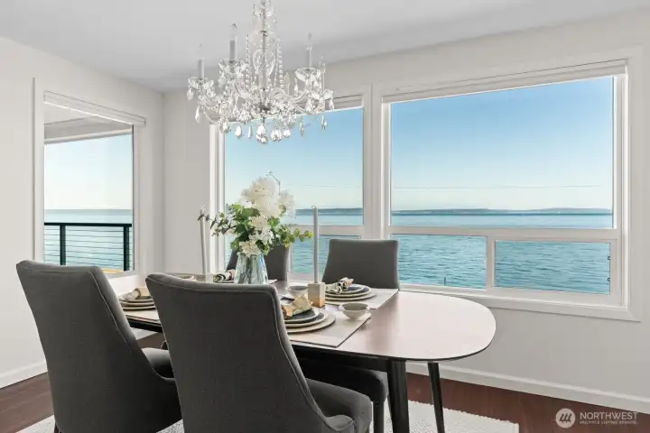 An all-occasion dining room with wall of glass offer spectacular views and illuminates light throughout