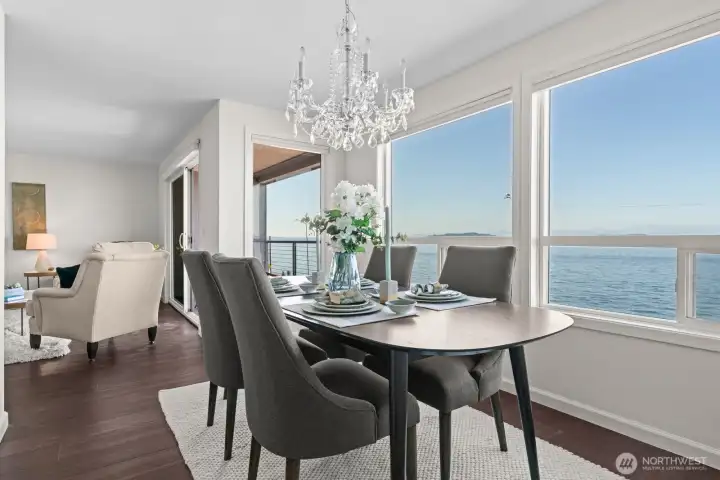 An all-occasion dining room with oversized windows and remote controlled blinds, illuminating the main living areas with natural light