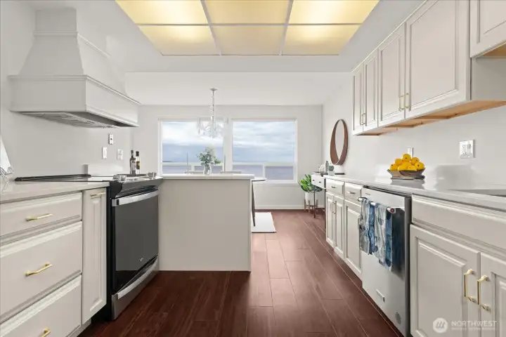 Enjoy cooking and entertaining in this view kitchen, with newer appliances and wood-like luxury vinyl flooring