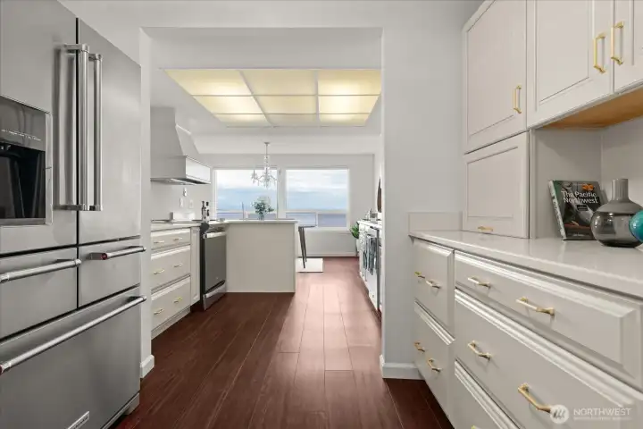 Newer, large stainless steel refrigerator with French doors and lower freezer area