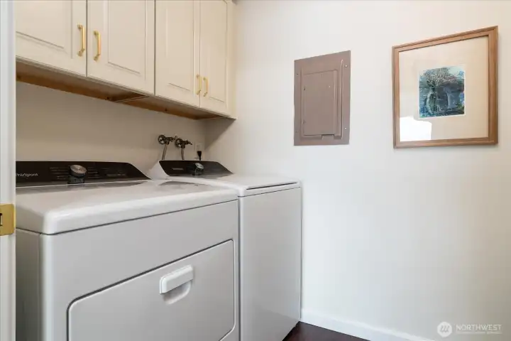 Laundry/pantry room off kitchen, offering additional storage cabinets