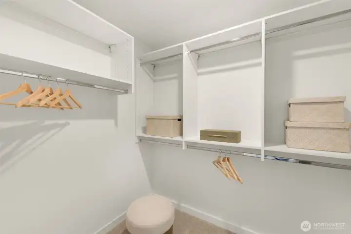 Indulge in the spa-like primary bathroom, complete with a contemporary dual vanity and elegant tile work.