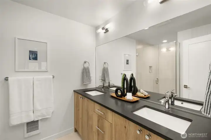 High-end fixtures and custom cabinetry provide both style and practical storage solutions.