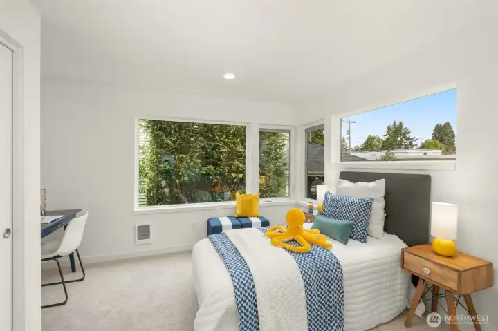 This flexible third bedroom is perfectly suited for guests, a home gym, or a creative studio.