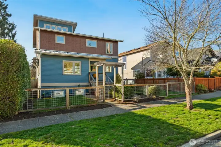 Fully fenced yard, and convenient gardening beds
