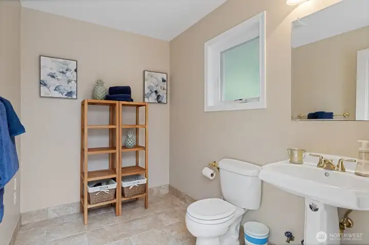 The pool cabana has a half bath.