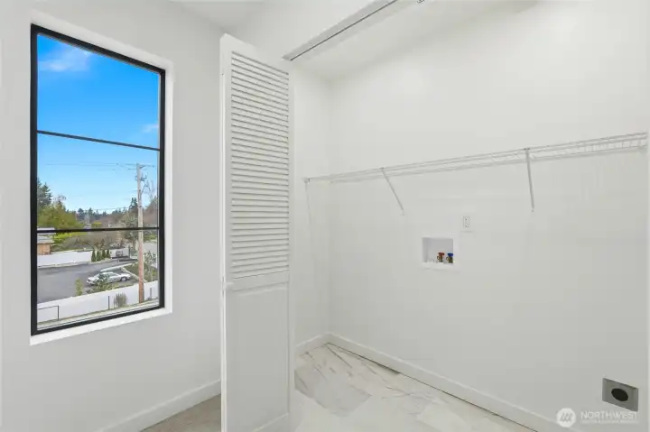 Laundry area with washer/dryer hookup and storage
