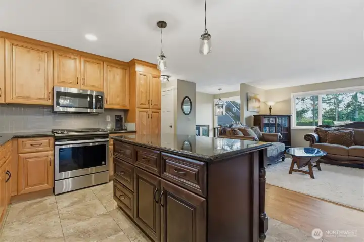 A spacious island topped with granite makes entertaining and food preparation easy.