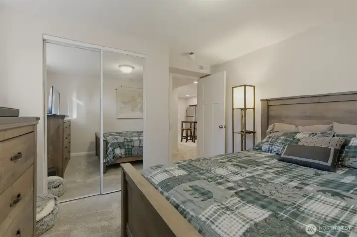 Bedroom #1 to lower level with mirrored closet doors