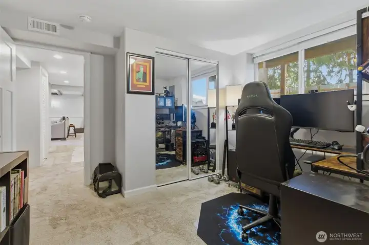 Bedroom #2 to lower level with mirrored closet doors