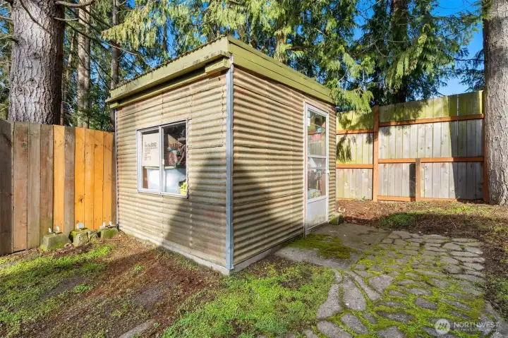Back yard has 2 outbuilding this is the green house