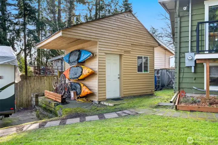 Photo of the 2 storage shed, great place to hang outdoor toys under overhang roof