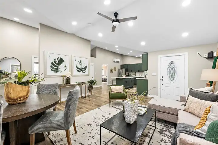Carefully thought out design allows for large kitchen connected to but separate from the living areas. Vaulted ceilings add loft and lightness to the space.