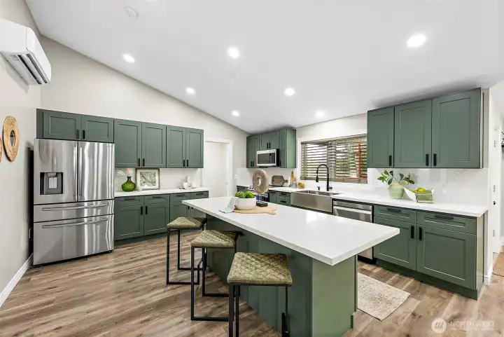 Large custom island provides storage, work space and seating for up to 5.