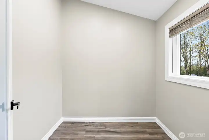 large vaulted pantry is ready to be customized to fit all the essentials.  Could also be a small flex space if not a pantry.