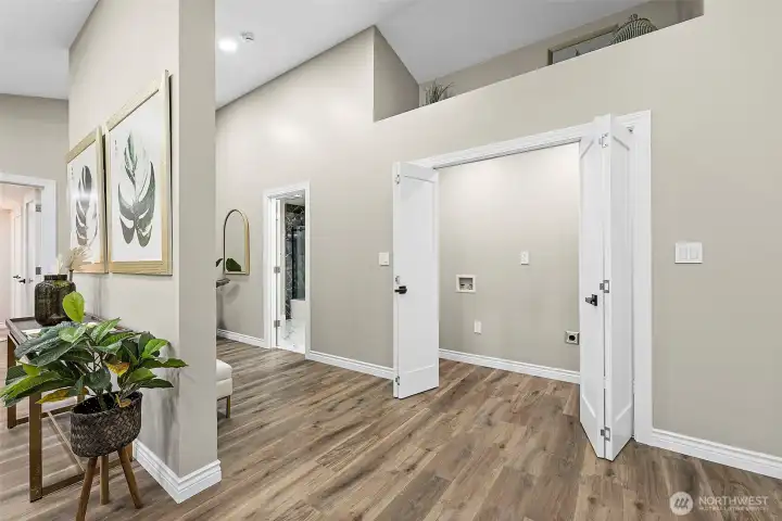 Laundry closet and custom designed artwork display space