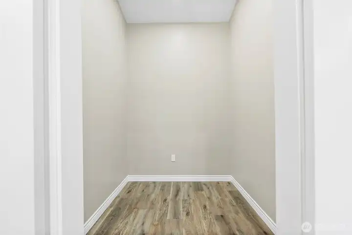 Large walk in closet with lofty vaulted ceilings is waiting for the buyer with vision for full height storage solutions that will turn this space into one of the most valued in the home