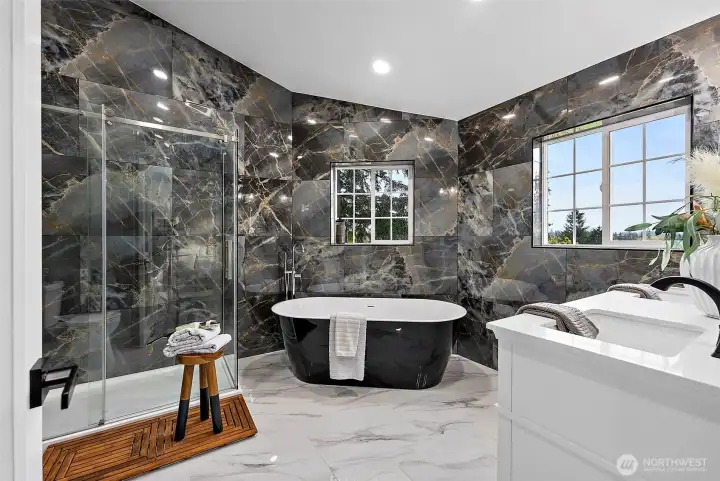 Glamourous and sleek with marble floors and walls