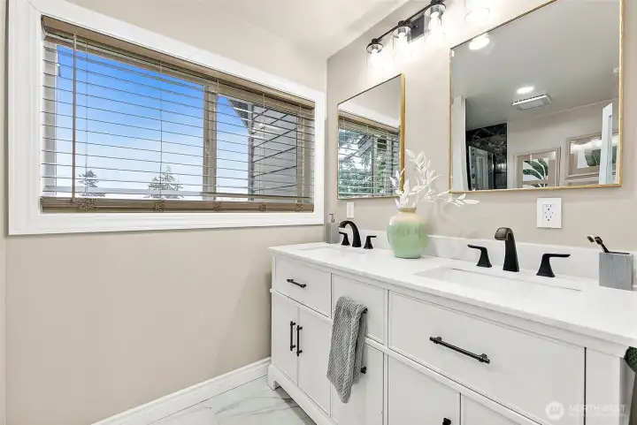 Marble floors, dual sinks and smart fan here as well.