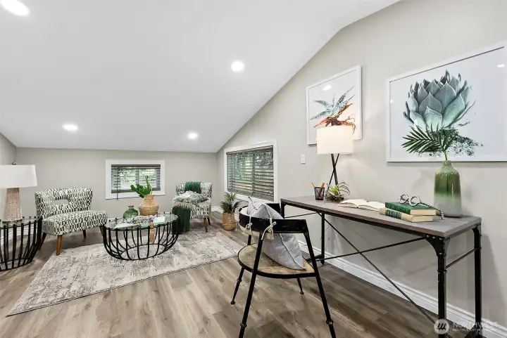 In wall cable ports behind the artwork allow for furniture placement on the opposite wall as well