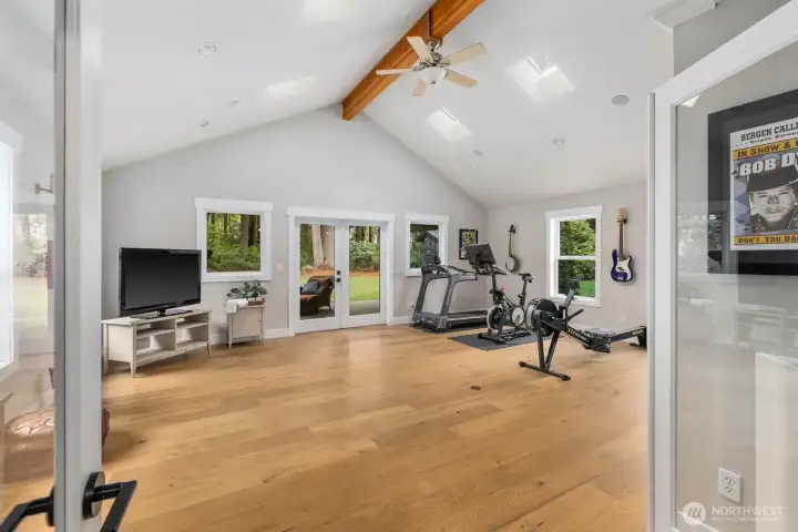 Vaulted flex space offering endless possibilities, gym, guest suite, or private theater