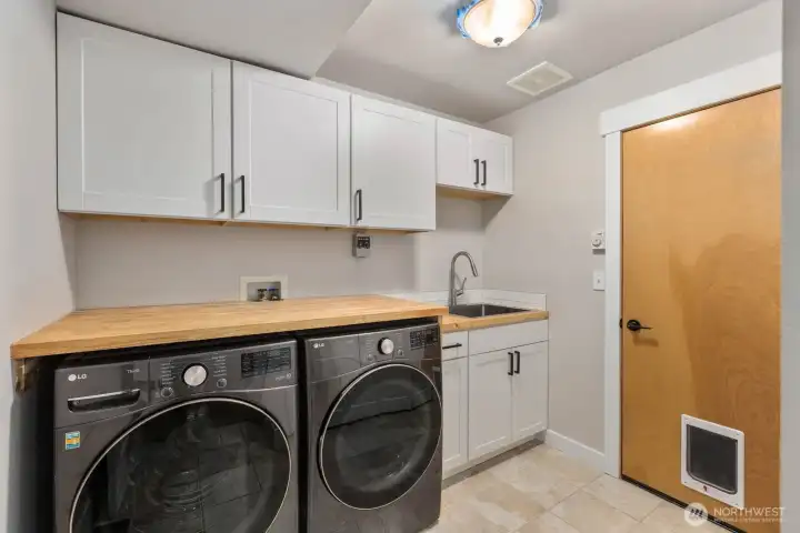 Practical utility space with washer and dryer included.